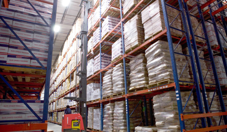 A fork truck unloads product onto Frazier's Sentinel Selective Pallet Racking.
