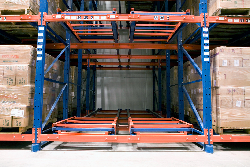 An unloaded bay of four pallet position deep Glide-In® Push Back rack.