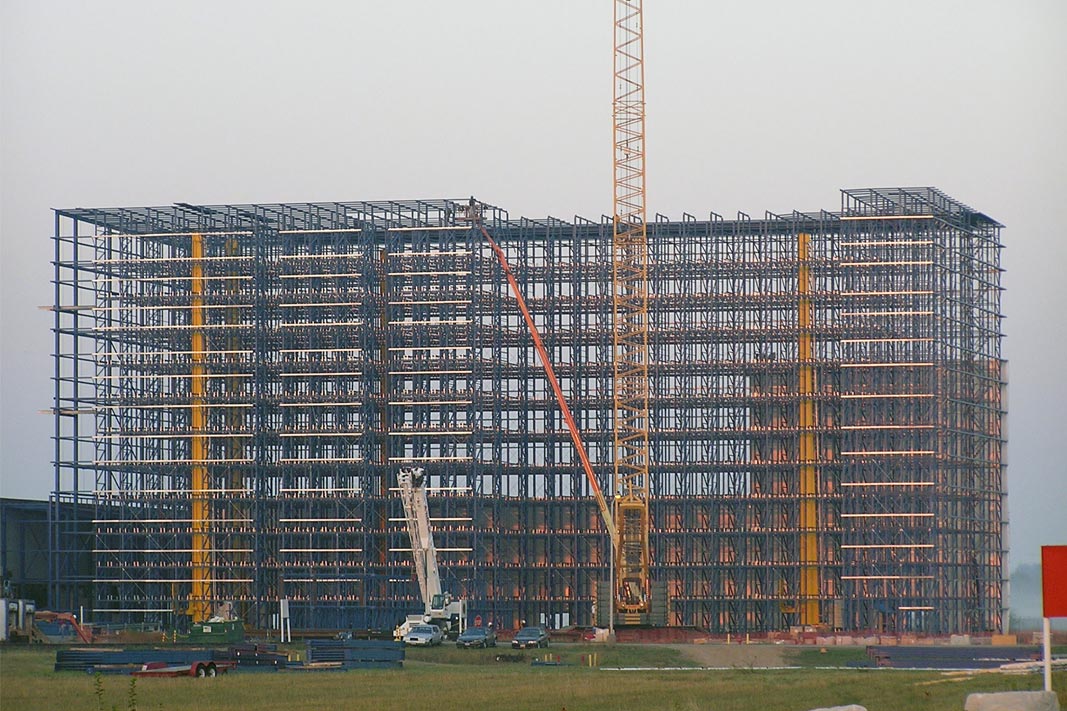 An AS/RS rack supported building under construction.