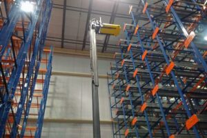 A Pallet Mole® being lifted into its rack system.
