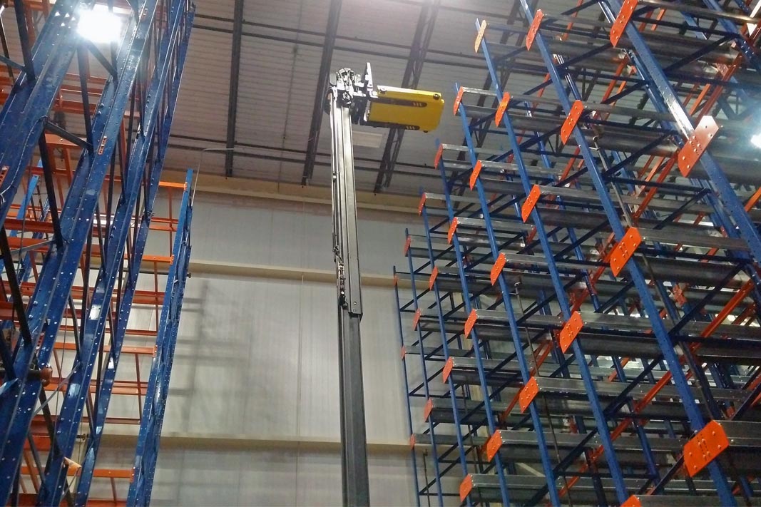 A Pallet Mole® being lifted into its rack system.